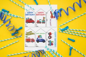 This image is showing one of the free printable birthday tags set - each tag has a different transportation vehicle.