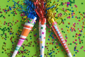 This image is showing one of the birthday party gift bag ideas you shouldn't include which are noisemakers.
