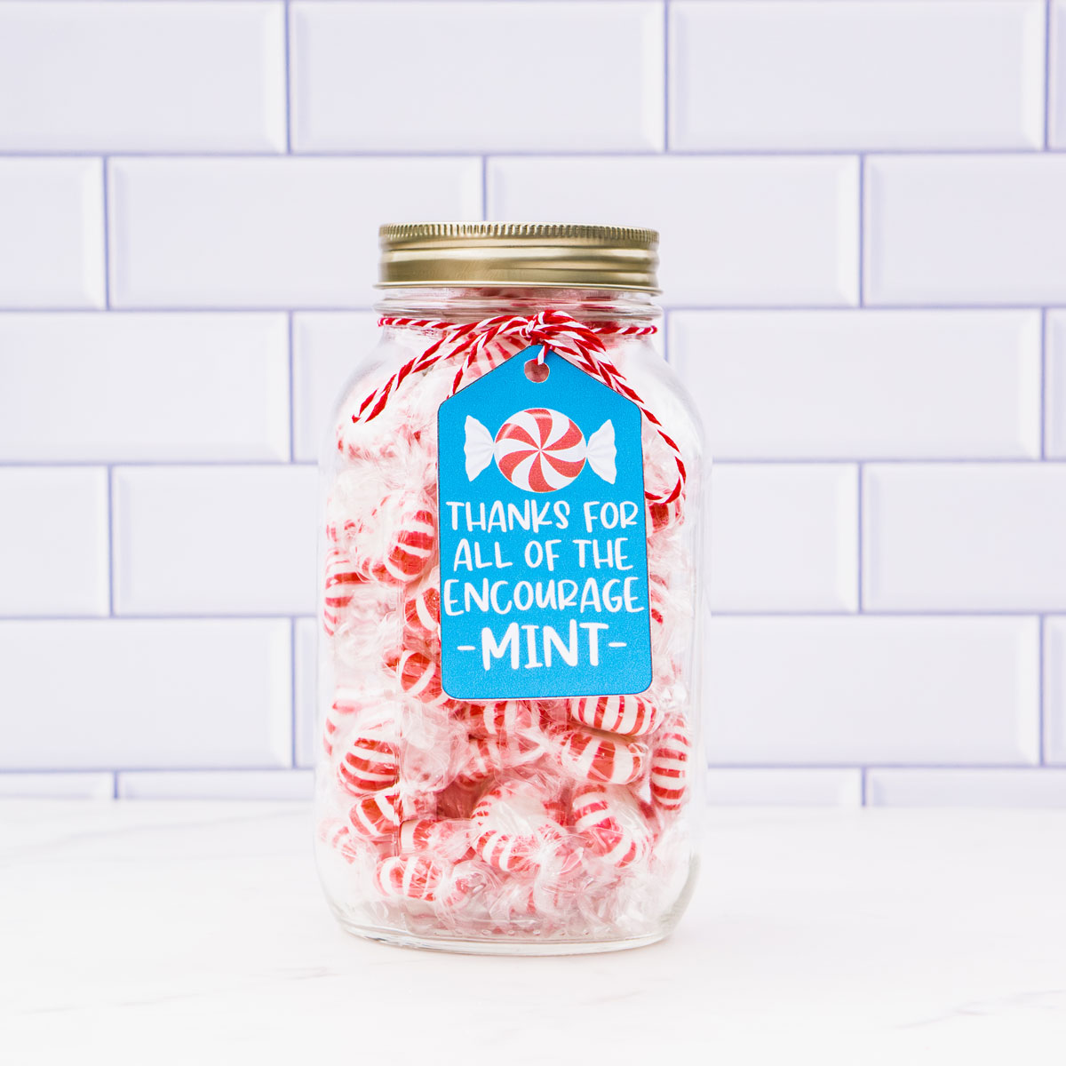 This image shows a jar of mints with a tag that says thanks for all of the encourage-mint.