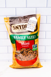 This image shows a bag of pretzels with a tag that says our school would knot be the same without you!