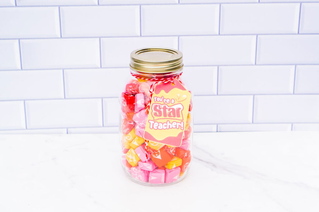 This image shows a mason jar filled with Starburst with a tag that says you're a star teacher.