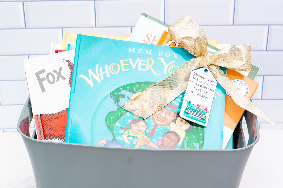 This image shows a basket full of books with the gift tag that says thanks for being such an important part of my story.