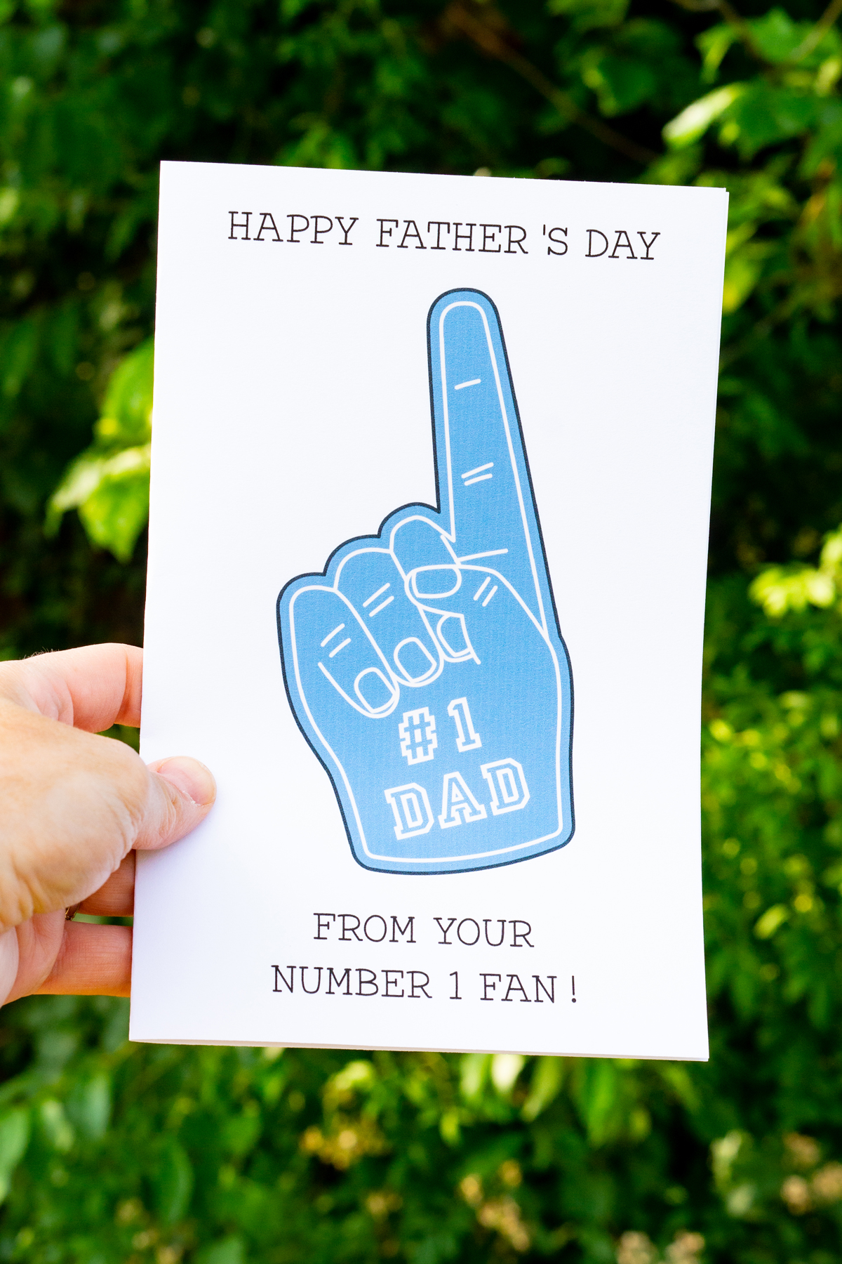 This is a picture of a card that says, "Happy Father's Day from your Number 1 Fan!" It has a foam finger with #1 Dad on the finger.