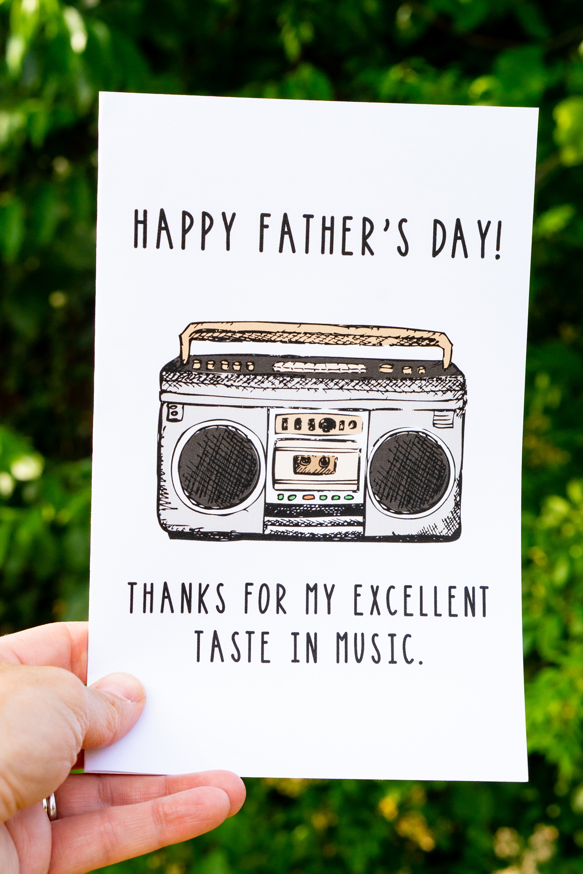 This card says, "Happy Father's Day! Thanks for my excellent taste in music." And it has a picture of a boombox.