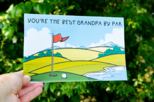The card says "You're the best Grandpa by par." And it features a golf course.