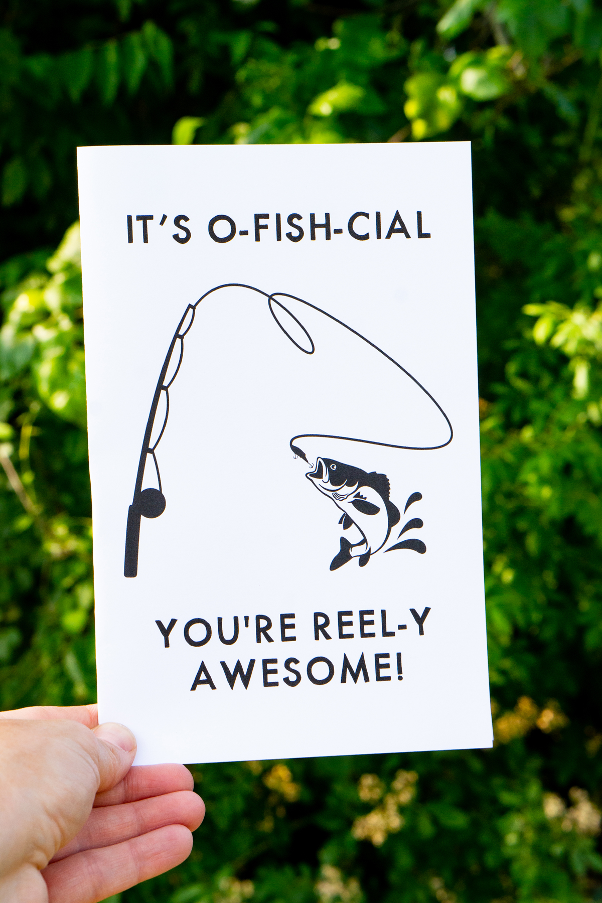 This card says, "It's o-fish-cial you’re reel-y awesome! It has a fish and fishing pole.