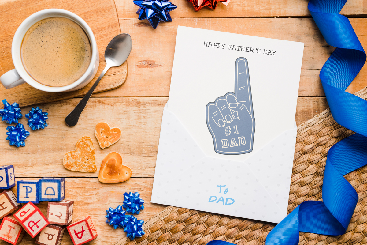 This is a picture of a card that says, "Happy Father's Day from your Number 1 Fan!" It has a foam finger with #1 Dad on the finger.