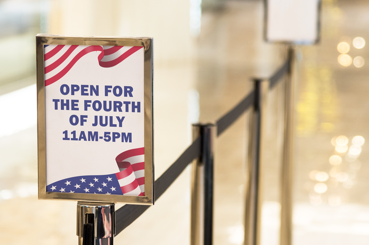 This shows a sign that says Open for the Fourth of July. This is one of the printable Closed and Open for 4th of July templates you can download in this blog post.