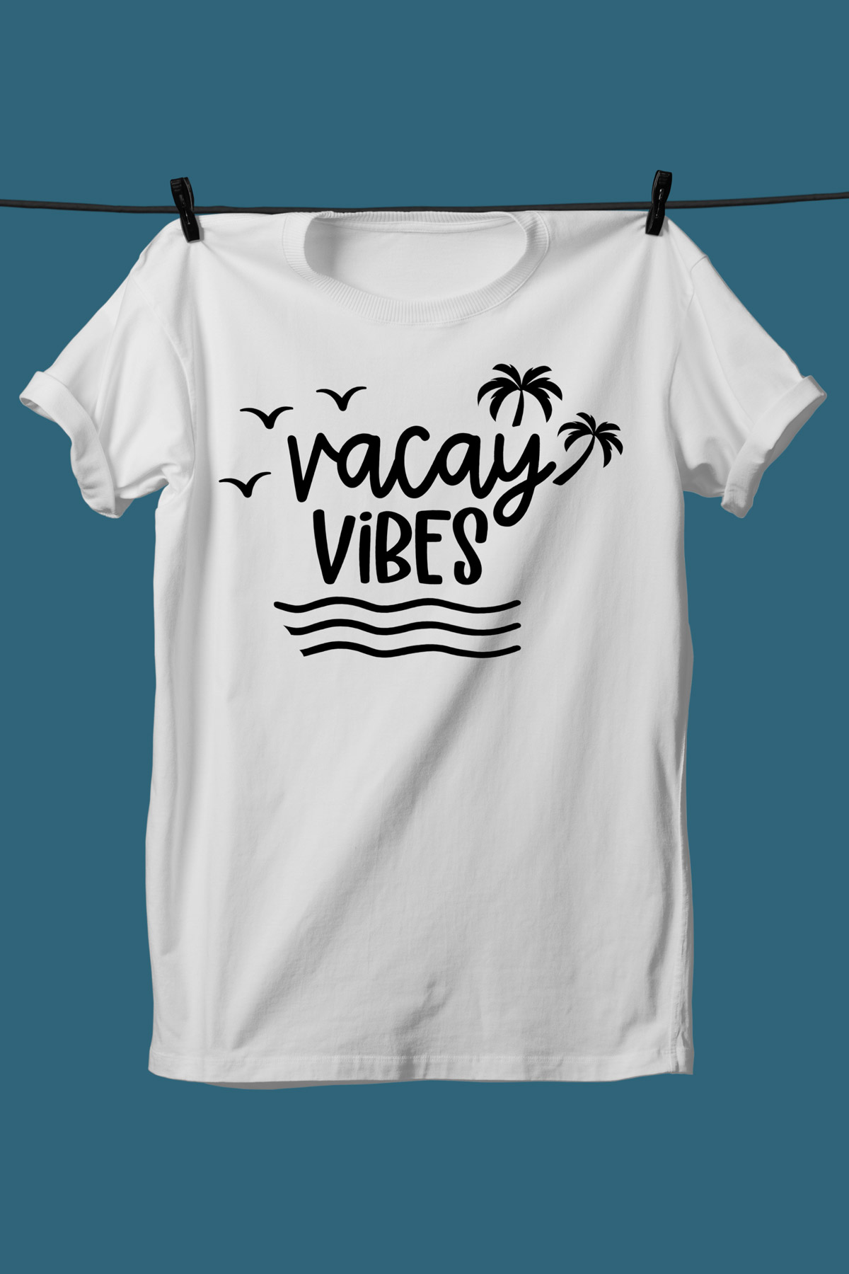 This image shows one of the SVGs from the free summer SVG set on a white tshirt. This one says Vacay vibes.