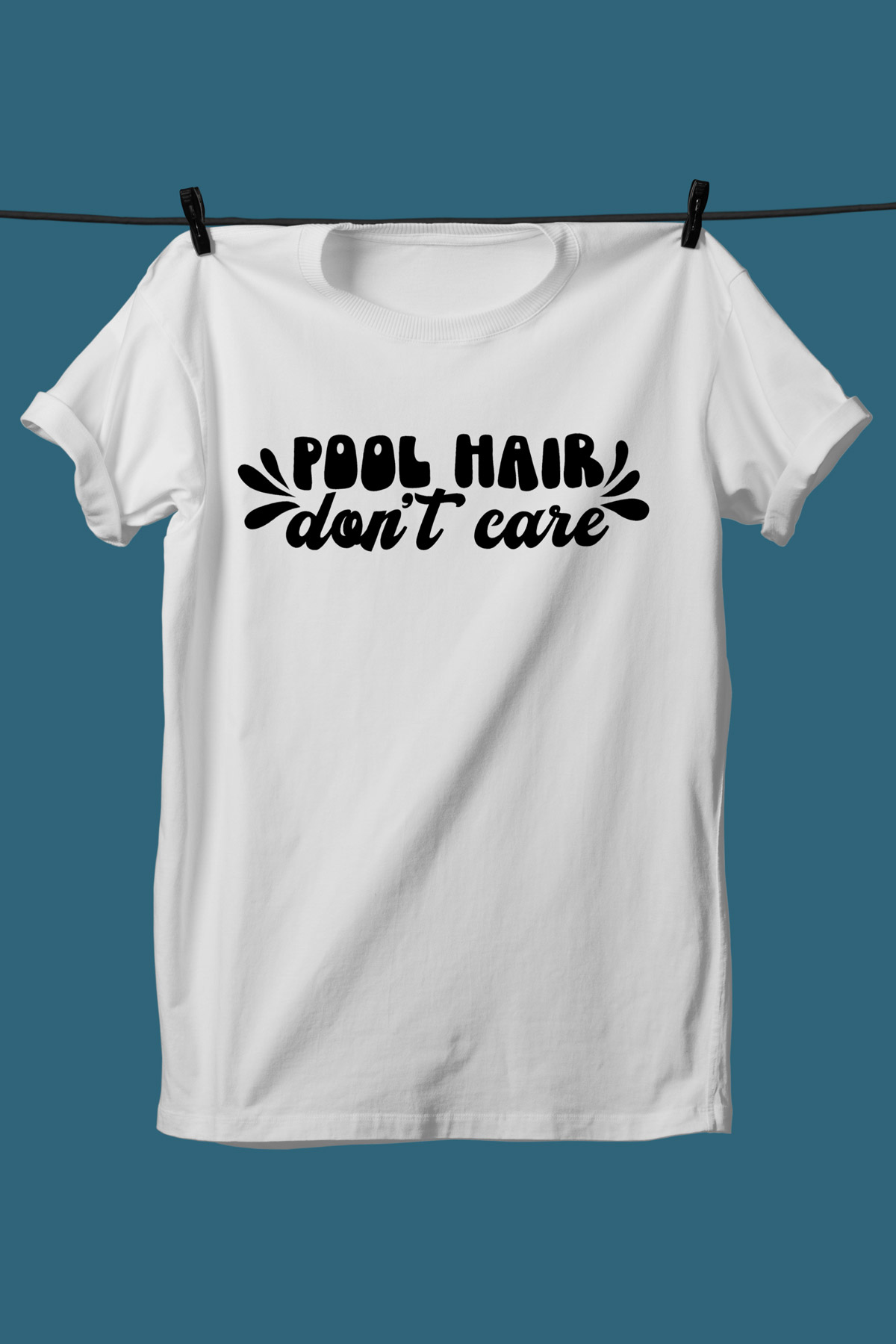 This image shows one of the SVGs from the free summer SVG set on a white tshirt. This one says pool hair don't care.