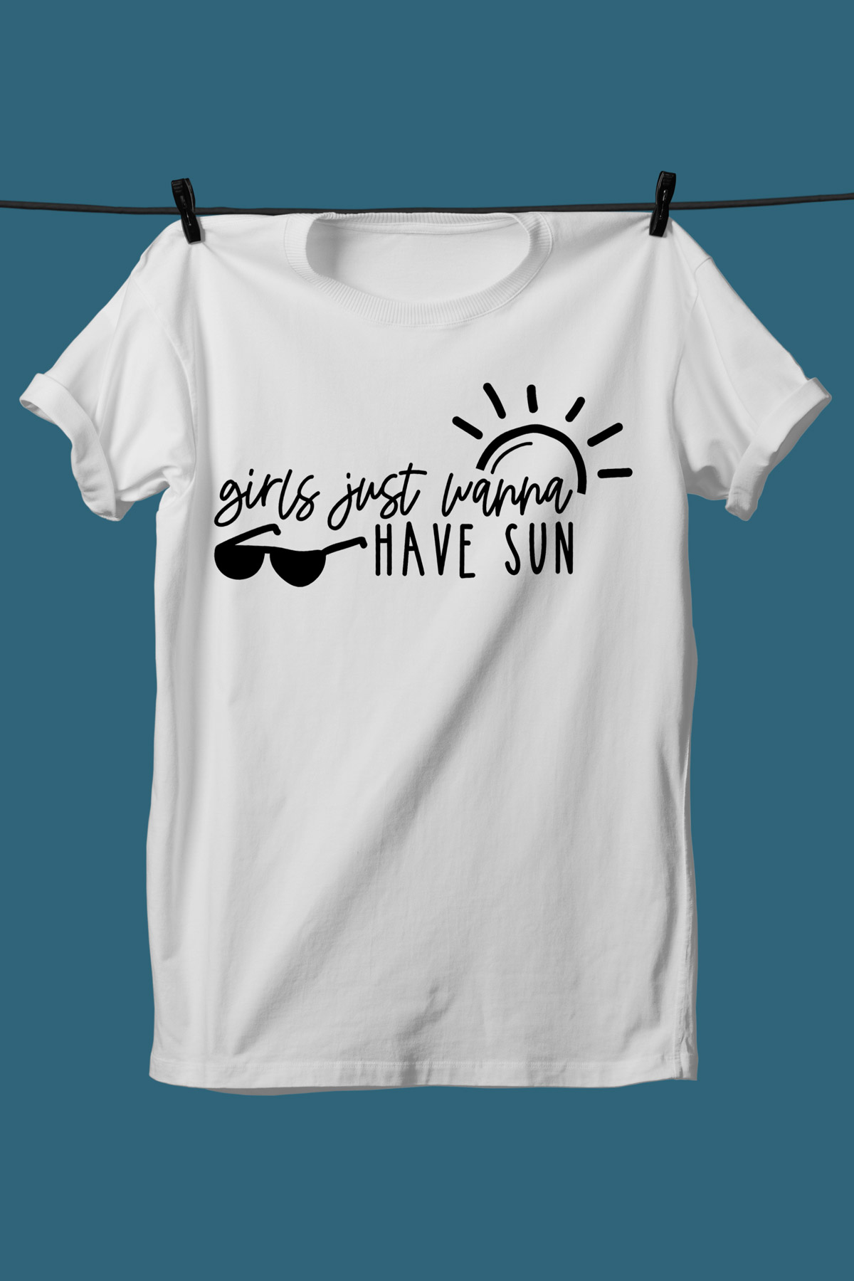 This image shows one of the SVGs from the free summer SVG set on a white tshirt. This one says girls just wanna have fun with sunglasses and the sun.