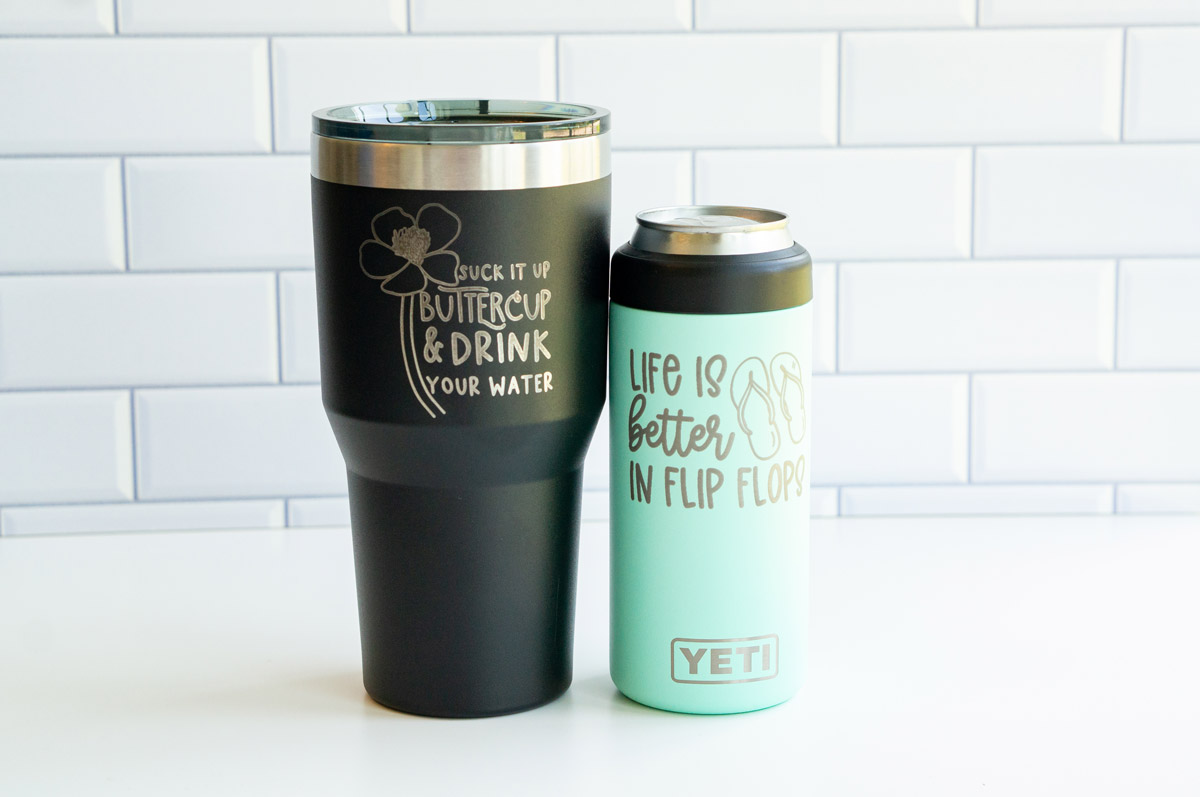 The image is of two engraved tumblers. One says suck it up buttercup & drink your water with the picture of a buttercup flower and the second one says life is better in flip flops with the picture of flipflops.