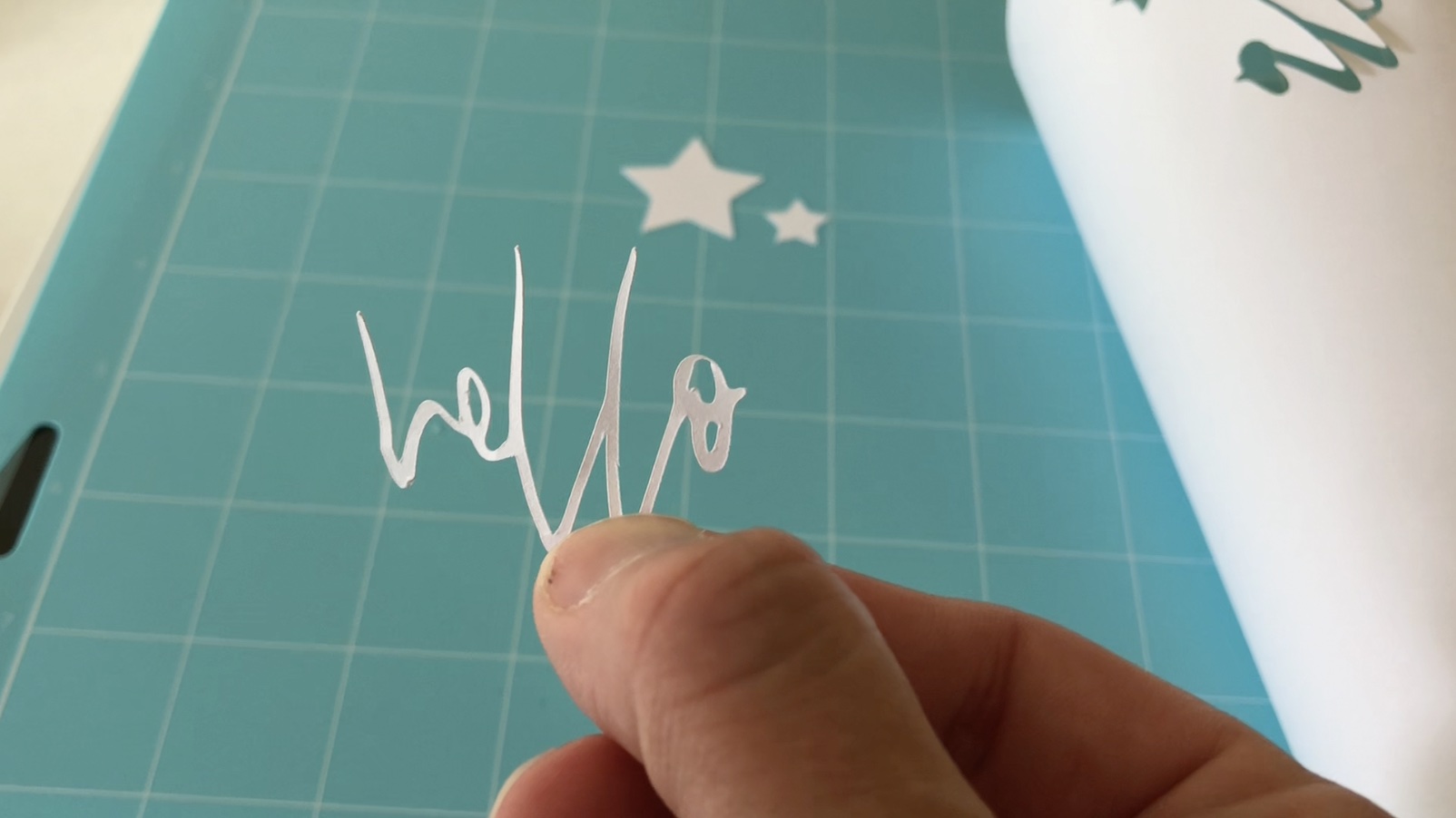 This image is showing the word Hello cut out of card stock using the xTool M1 machine.