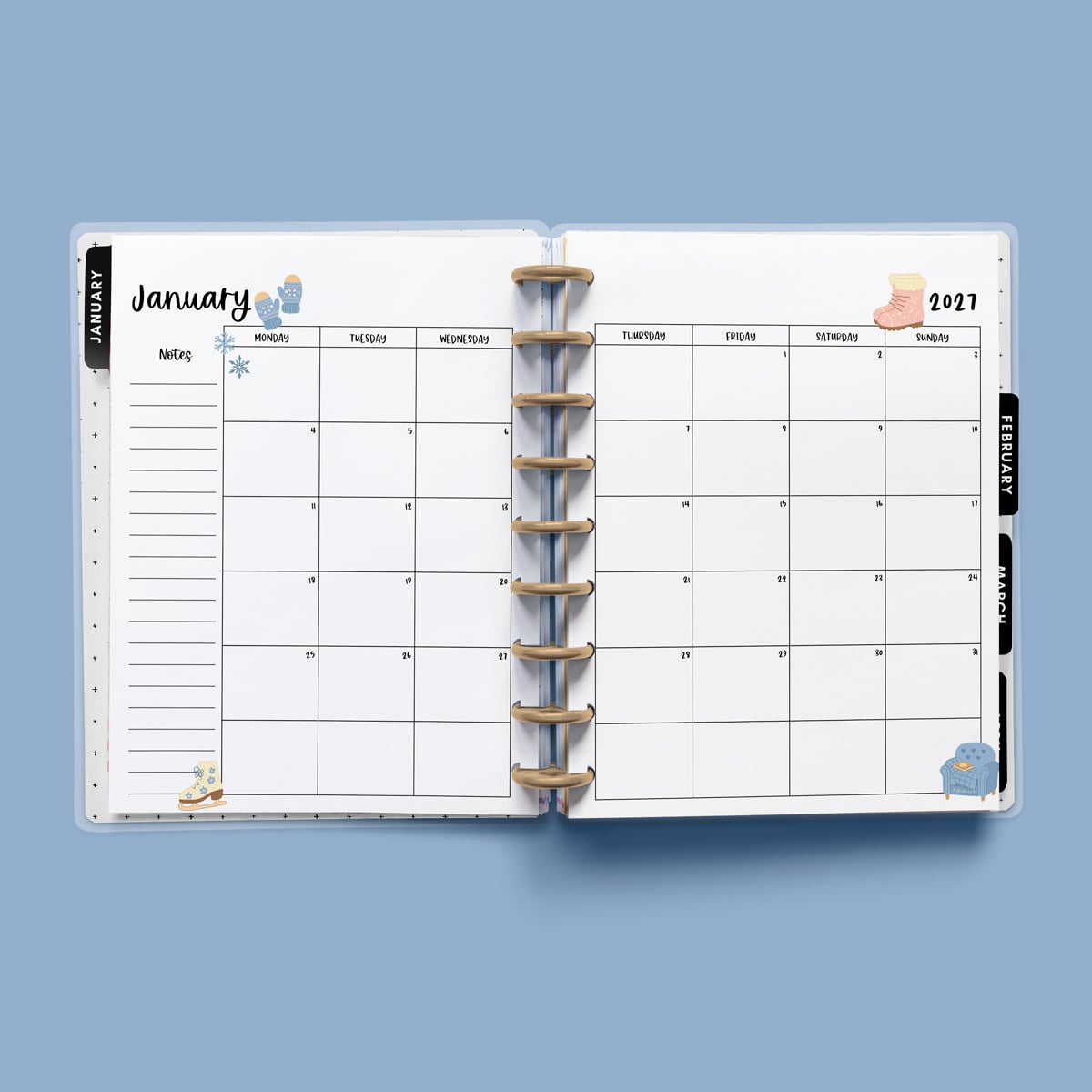This image is an example of one of the printable 2027 calendar you can get for free at the end of this post. This is showing the month of January without holidays inside of an open planner.