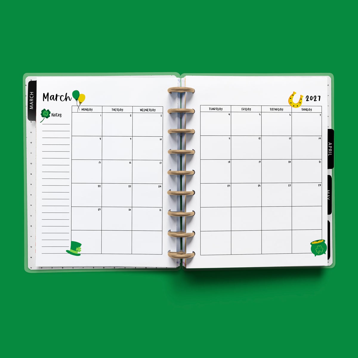 This image is an example of one of the printable 2027 calendar you can get for free at the end of this post. This is showing the month of March without holidays inside of an open planner.