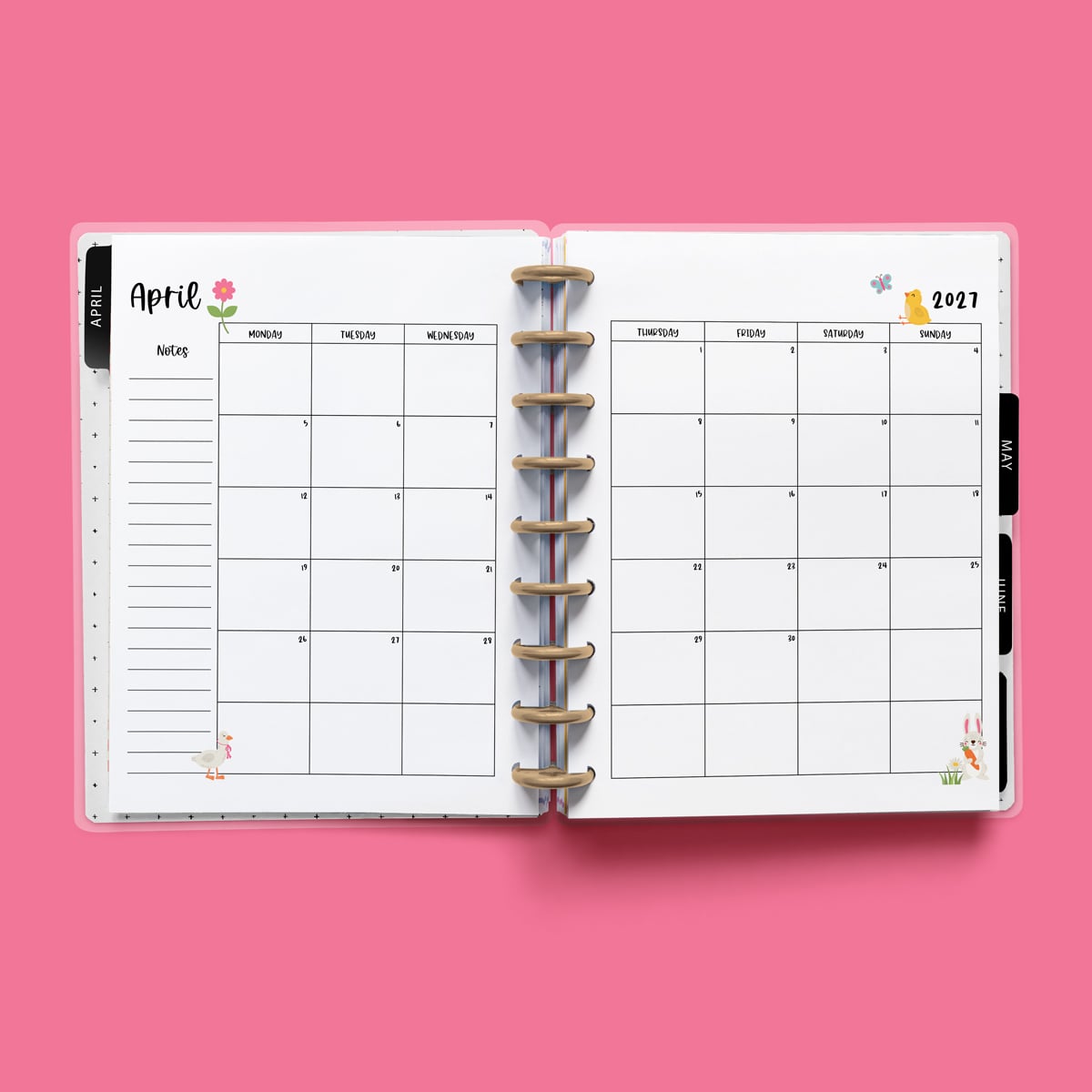 This image is an example of one of the printable 2027 calendar you can get for free at the end of this post. This is showing the month of April without holidays inside of an open planner.