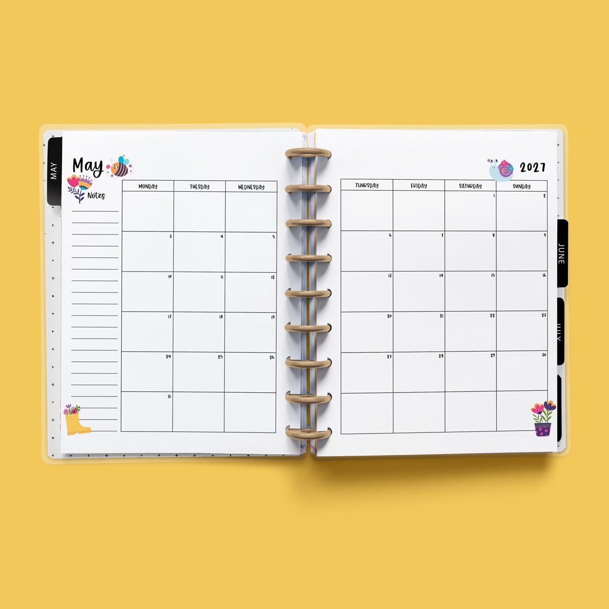 This image is an example of one of the printable 2027 calendar you can get for free at the end of this post. This is showing the month of May without holidays inside of an open planner.