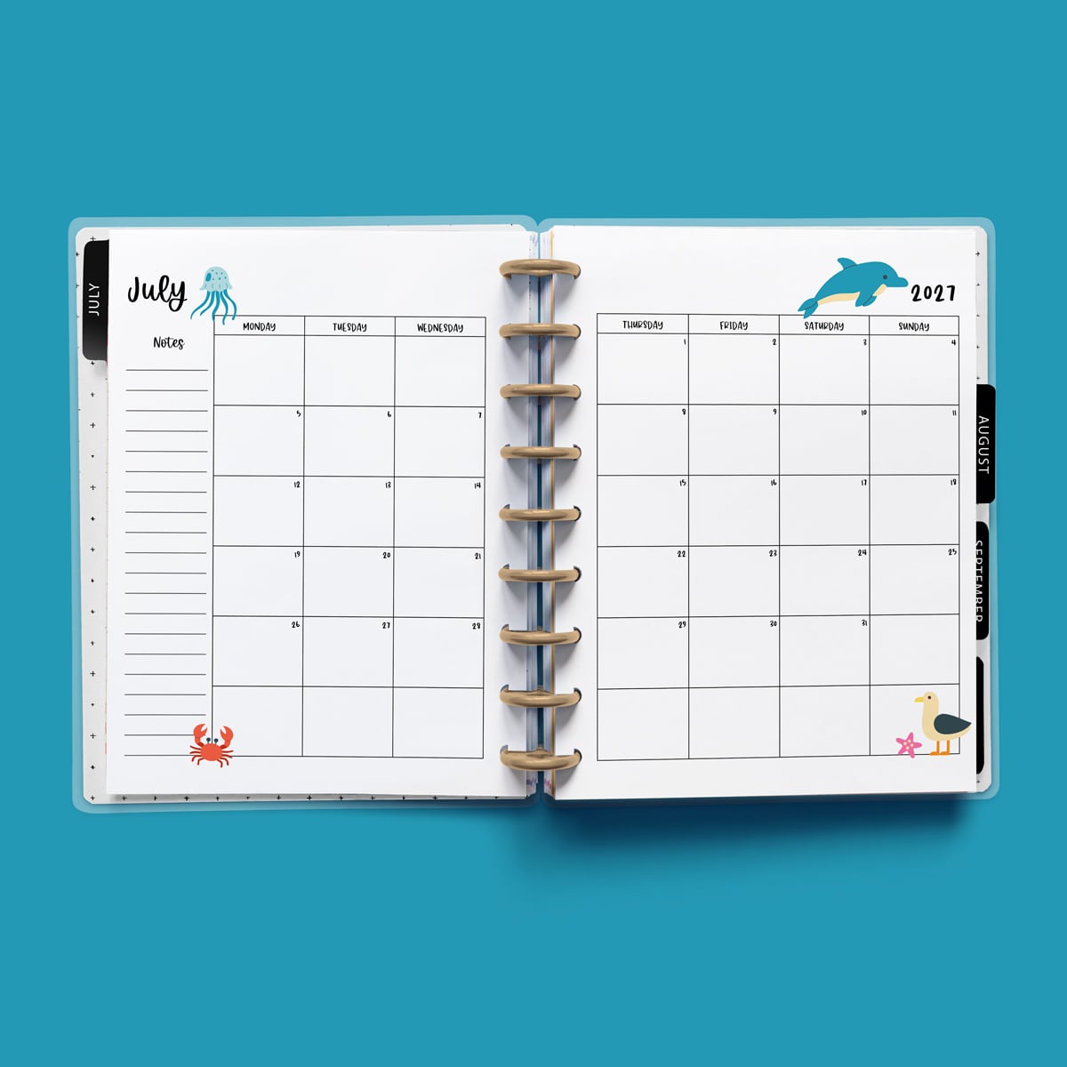 This image is an example of one of the printable 2027 calendar you can get for free at the end of this post. This is showing the month of July without holidays inside of an open planner.