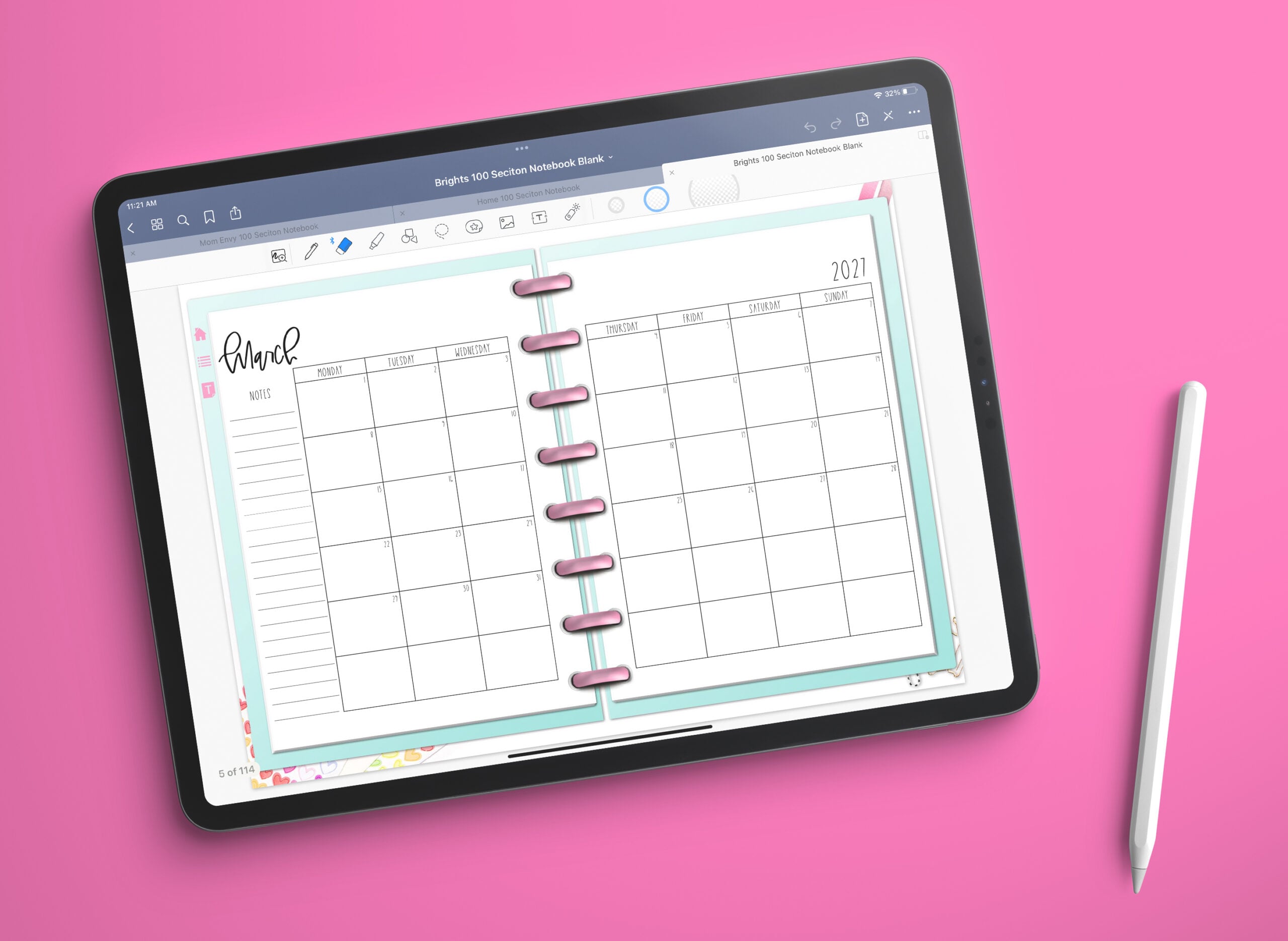 This image shows the free 2 page calendar template you can get at the end of this blog post. It's inside of an open planner to the month of March.