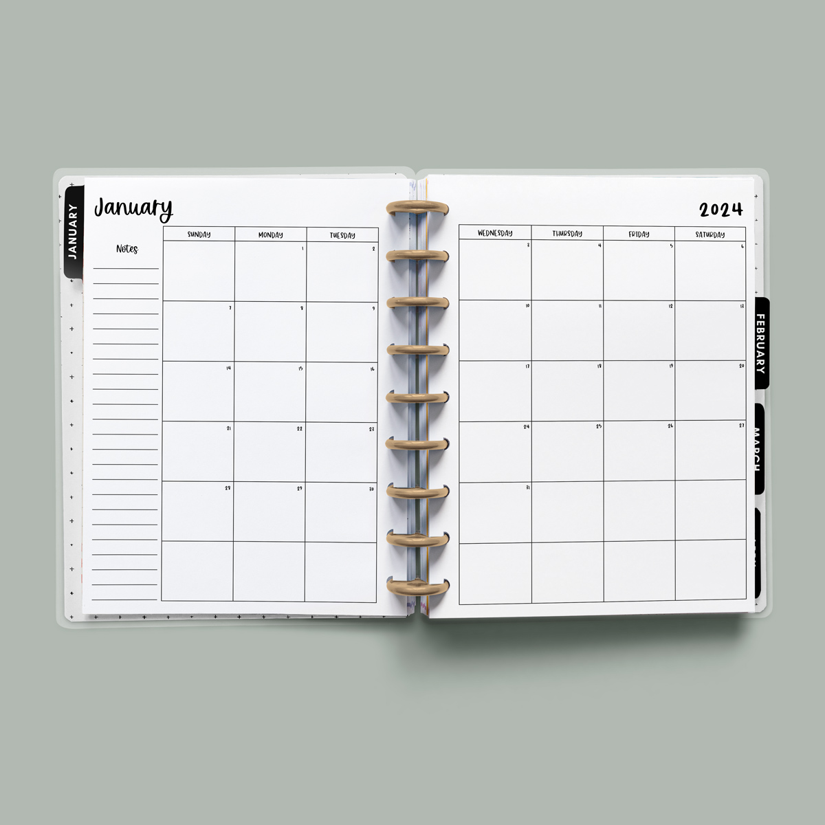 This image is an example of one of the printable 2024 calendar you can get for free at the end of this post. This is showing the month of January without holidays or clipart inside of an open planner.