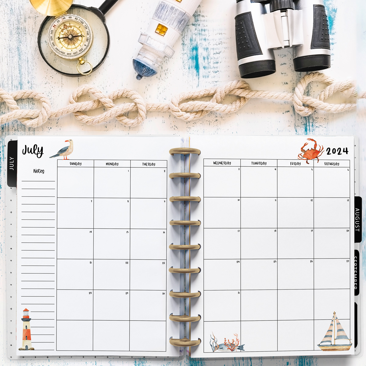 This image is an example of one of the printable 2024 calendar you can get for free at the end of this post. This is showing the month of July. Above the planner is some rope and nautical items.