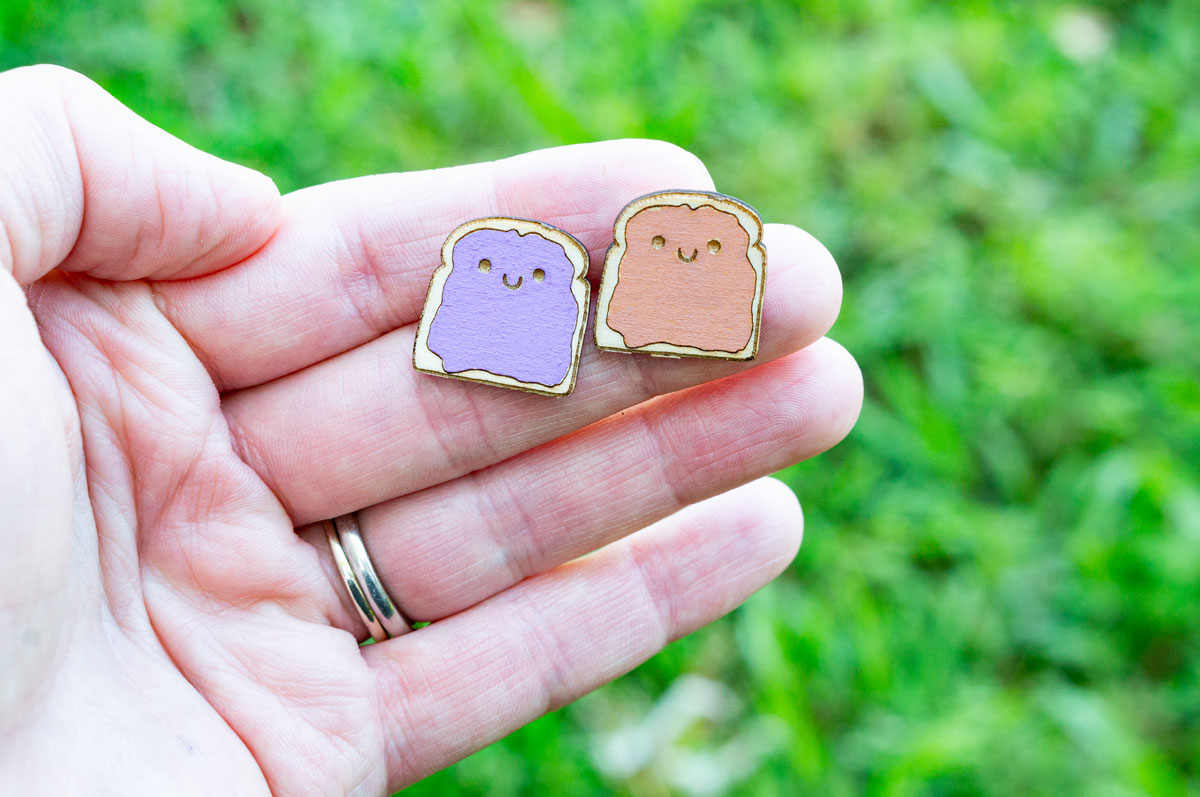 This is an image of a completed pair of wood earrings - peanut butter and jelly - made with an xTools M1 laser machine. Learn how to make the wood earring in the post.