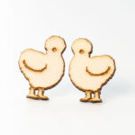 This is an image of a completed pair of wood earrings - silkie chickens - made with an xTools M1 laser machine. Learn how to make the wood earring in the post.