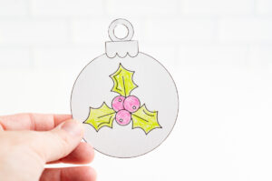 This image shows one of the free printable ornaments colored and cut out.