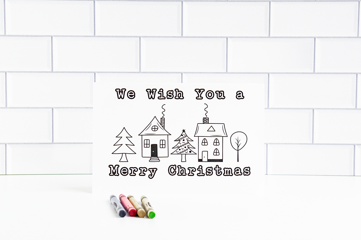 This is one of the 25 free printable Christmas cards to color you can get for free in this blog post. This one says we wish you a Merry Christmas.