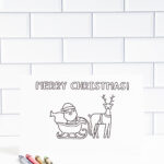 This is one of the 25 free printable Christmas cards to color you can get for free in this blog post. This one says Merry Christmas.