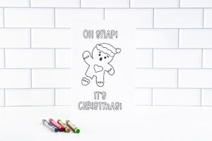 This is one of the 25 free printable Christmas cards to color you can get for free in this blog post. This one says Oh Snap! It's Christmas! with a gingerbread man with a broken leg.