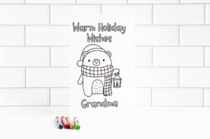 This is one of the 25 free printable Christmas cards to color you can get for free in this blog post. This one says warm holiday wishes grandma.
