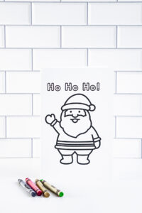 This is one of the 25 free printable Christmas cards to color you can get for free in this blog post. This one says Ho Ho Ho!