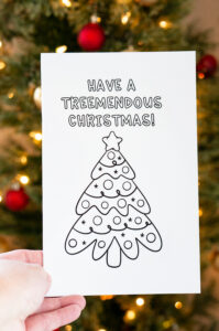 This is one of the 25 free printable Christmas cards to color you can get for free in this blog post. This one says Have a Treemendous Christmas! with the picture of a tree.