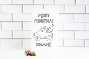 This is one of the 25 free printable Christmas cards to color you can get for free in this blog post. This one says Merry Christmas Grammy.
