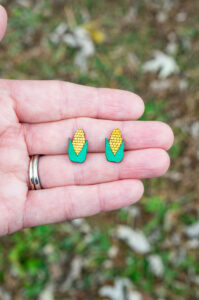 This shows the final corn earrings made using the free Thanksgiving earrings SVG files.