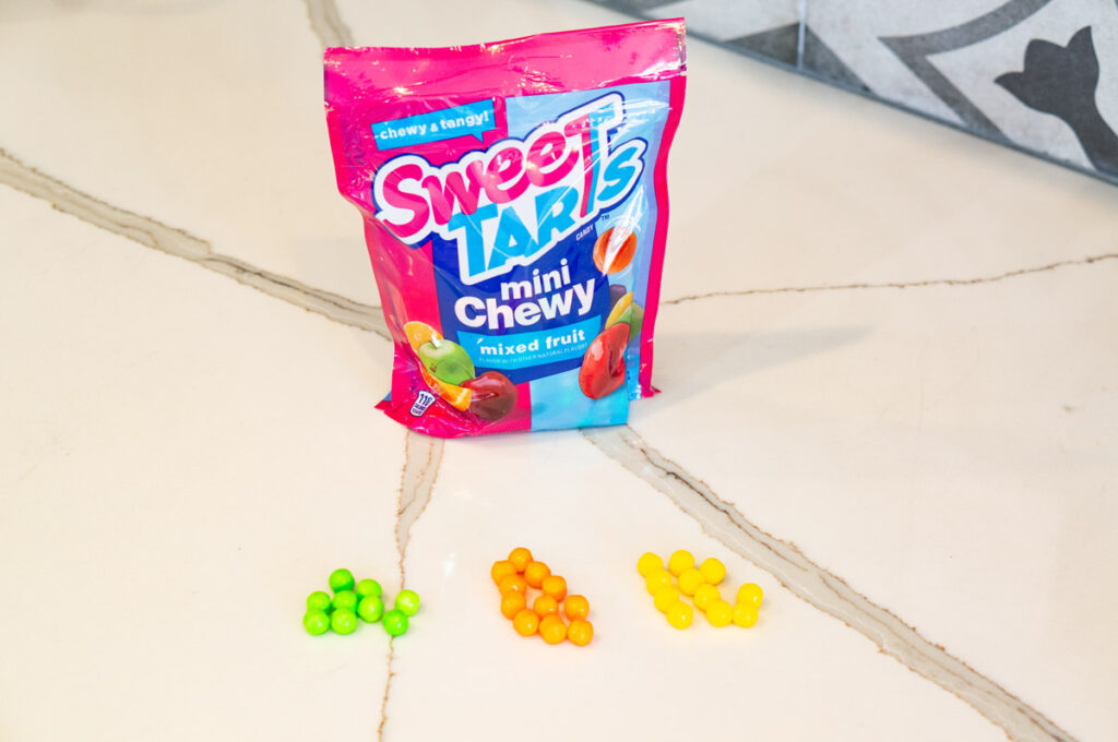 This image is showing Sweet Tarts Chewy to represent carrots, peas, and corn.