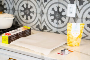 This image shows parchment paper on a sheet pan in preparation for making butter to go on the Turkey Dinner cookie sets.