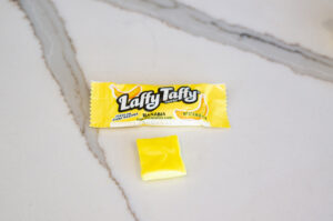 This image shows cut out square of taffy to act as faux butter on a turkey dinner cookie kit.