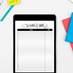 iPad displaying the ‘27 Goals for 2027’ digital planner page on a white desk with glasses, sticky notes, books, and a plant.