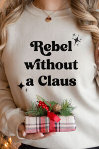 This is one of the free funny Christmas shirts you can make with the free SVGs from the post. This one says Rebel without a Claus.