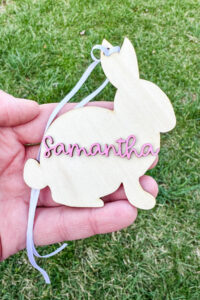 This image shows one of the Easter basket tags made out of wood using an xTool laser machine. It's in the shape of a rabbit with the name Samantha on it.