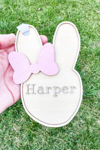 This image shows one of the Easter basket tags made out of wood using an xTool laser machine. It's in the shape of a bunny head with the name Harper on it.