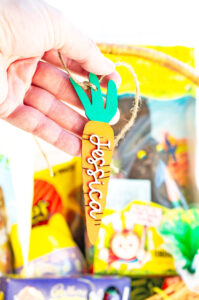This image shows one of the Easter basket tags made out of wood using an xTool laser machine. It's in the shape of a carrot with the name Jessica on it.