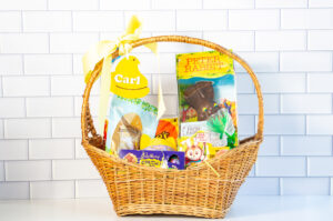 This is an example of one of the free Easter basket tag SVG files completed using a laser machine. The tag is a yellow peep that says Carl and is hanging from a basket.