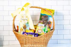 This is an example of one of the free Easter basket tag SVG files completed using a laser machine. The tag is an egg that says Camden and is hanging from a basket.