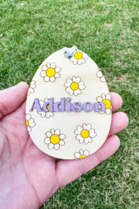 This image shows one of the Easter basket tags made out of wood using an xTool laser machine. It's in the shape of an egg with the name Addision.
