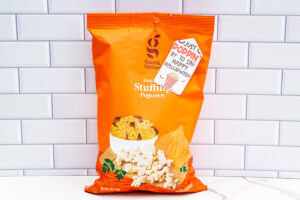This is a bag of stuffing flavored popcorn from Target (Good & Gather company). The gift tag says Just Poppin' By to say Happy Halloween. The gift tag is one of the free printable Halloween tags you can get in this post.