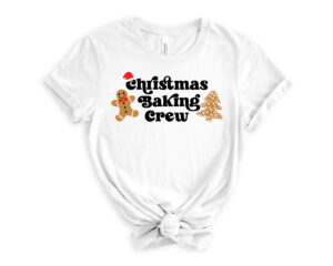 This image shows the free Christmas Baking Crew SVG. It shows a tshirt that says "Christmas Baking Crew" with a gingerbread man and tree cookie.