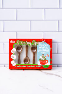 This is one of the free Christmas treat gift tags you can download in this post. It says, You’re Worth Melting For. It features a marshmallow snowman soaking in hot cocoa in a mug with some cookies and treats surrounding the mug. The tag is attached to a box of chocolate spoons.